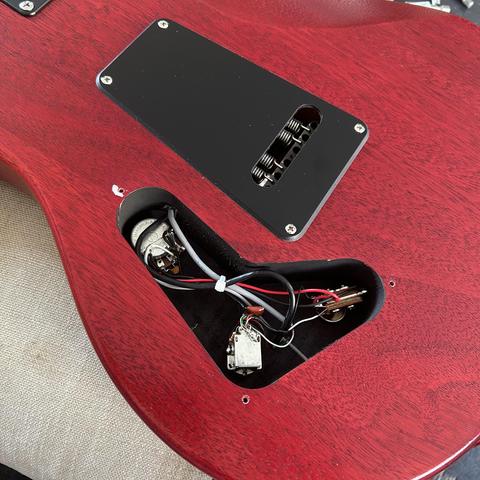 Closeup of the cavity on the back of the guitar where the electronics live - the cover is off