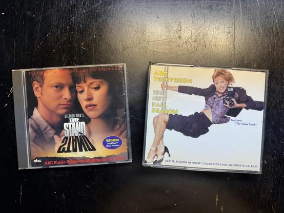 A photo of two CD-ROM press kids from 1995. One for ABC TV's miniseries The Stand, and the other featuring all the new shows on ABC for Fall 1995.