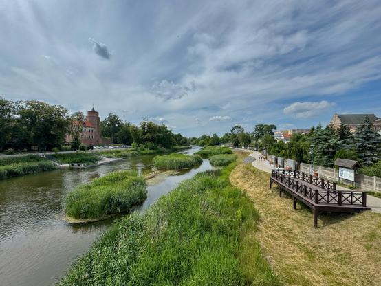 View from a bridge in Uniejów - Warta river and Uniejów Castle.