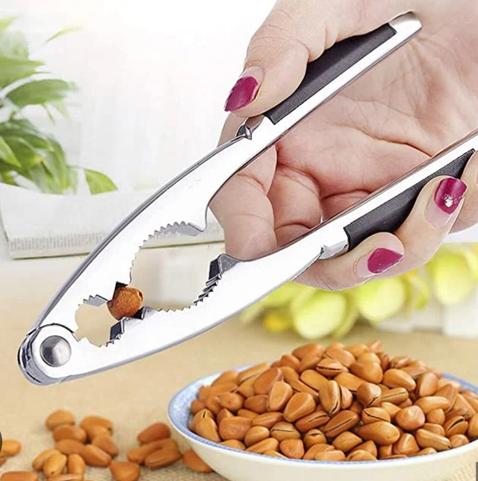 a handheld nutcracker, the type with toothed jaws and a hinge at the far end. This one hold a pistachio, which looks comically undersized, especially when contrasted with the walnuts usually depicted. For some reason I thought this one seemed appropriate when speaking of Trump.