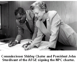 Social Security Commissioner Shirley Chater and AFGE President John Sturdivant of the AFGE signing the NPC charter.