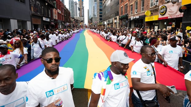 Pride celebration with rainbow flag.