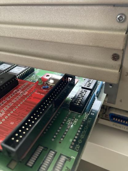 With the header installed, the board is slightly too tall to fit into the PC-98 without removing the adjacent slot cover.