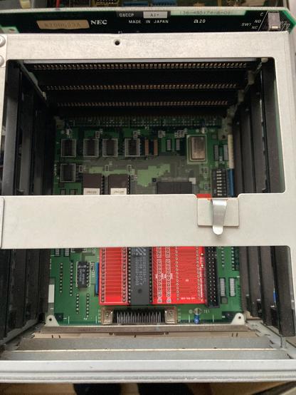 Once installed, the board adds a lovely splash of colour that is blocked by the stupid and inexplicable razor-sharp structural brace holding the card cage in square.