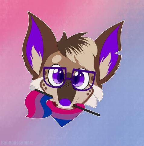 A headshot of Jordan the chihuahua wearing a bisexual flag bandana and holding a bisexual flag in her mouth