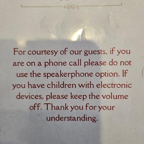 From the front of a restaurant menu: "For courtesy of our guests, if you are on a phone call please do not use the speakerphone option. If you have children with electronic devices, please keep the volume off. Thank you for your understanding."