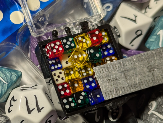 tiny Dice with a Rules for scale