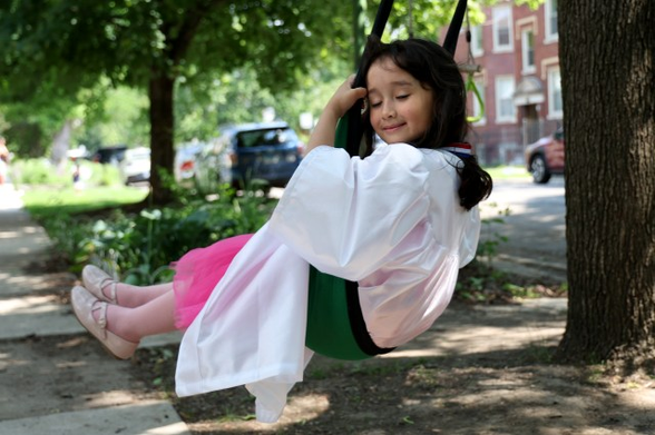 A pic of the young girl on a swing: