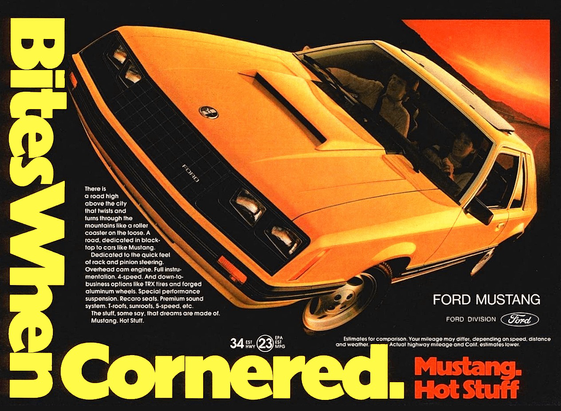 The car is a very yellow shade of orange. It is leaning from top to bottom in an aggressive stance. The title says bites when cornered.