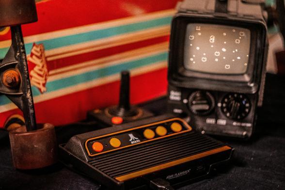 tari Flashback console playing Asteroids connected to a portable television in front of a skateboard
Photo by Boris Langvand on Unsplash