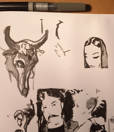 Detalhe de caderno de esboços com pincel caneta.