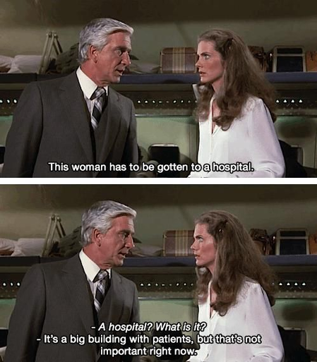 The image is a split screen showing two scenes from what appears to be a movie or television show, likely from the 1970s judging by the fashion and film style. 

Top Panel:

From the movie "Airplane!"

Top panel:
A mature man with graying hair and a neatly pressed suit (the main character) is talking to a woman with long, flowing brown hair, dressed in a white blouse. The woman looks concerned or perhaps slightly impatient.
The background appears to be an airport baggage claim area. The lighting and overall ambiance are somewhat muted.

A caption reads, "This woman has to be gotten to a hospital."

Bottom Panel:

The same man and woman are shown, closer together and from a slightly different angle. The man's expression is more assertive or explanatory. The woman appears to be listening intently, showing a look of curiosity or slight disbelief.
The background is identical to the top panel, suggesting a continuous scene.
The captions read:
"- A hospital? What is it?" (Woman's line)
"- It's a big building with patients, but that's not important right now." (Man's line).