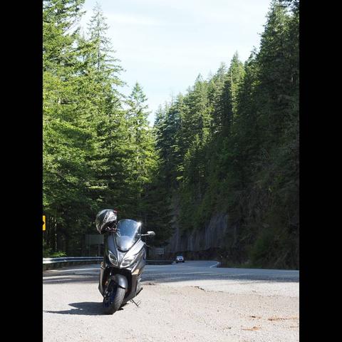 Photo by Neil E. Hodges on June 29, 2021. May be an image of motorcycle, road, tree and nature.