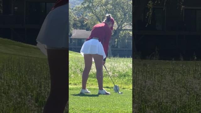 Golfers golfing