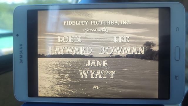 Photo of the opening screen of House By The River [1950] playing on my tablet in the woods.