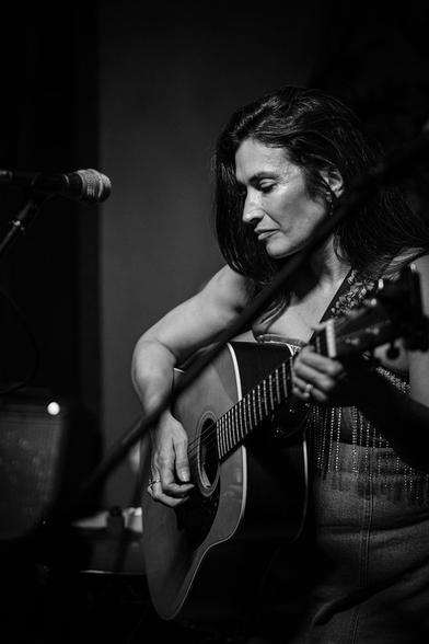 Monochrome: Patti Rojas performing with her guitar