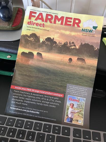 The cover of the most recent Farmer Direct catalog. The cover image is of beef cattle grazing in a misty paddock with eucalyptus fringe in the background.