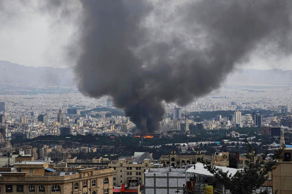 The smoking skyline of Tehran after an Israeli bombing.