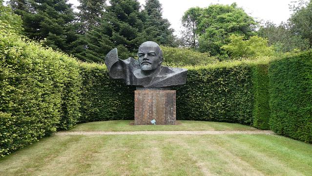 Once this huge bronze head of Lenin sat atop the KGB building in the town of Preiļi in Latvia. Sculpted by Dzintra Jansone, it is monumental in scale.  After the collapse of the Soviet Union, it was removed and eventually went on sale by Sotheby auction house at a sculpture sale at Chatsworh. Who profited? And how the dealer managed to acquire it remains a mystery! The sale price was approximately twenty thousand pounds.   It ended up in a sculpture garden of a man who was a former deputy Prime Minister of the United Kingdom, and the man whose leadership challenge brought down Margaret Thatcher - Baron Heseltine of Thetford also known as Michael Heseltine. Now it sits  in its own room , surrounded by  beech hedges and yew hedges in the rolling green soft landscape of Northamptonshire in England, The irony.