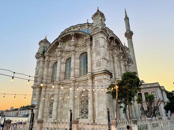 An ornate stone mosque at dusk