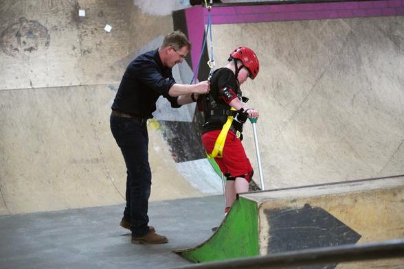 Ollie skating on the harness with Dr Ross Head