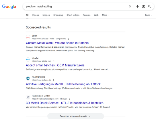 4 Google Ads for "precision metal etching" with a headline "Sponsored results". A grey button is added at the bottom saying "See more sponsored results".