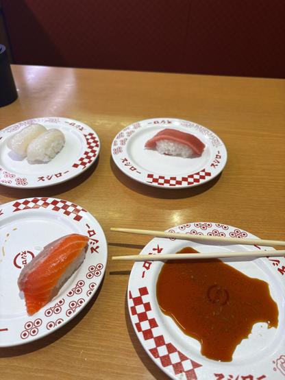 A gentle start to the conveyor belt sushi dinner, with just three modest plates of nigiri sushi waiting to be savored