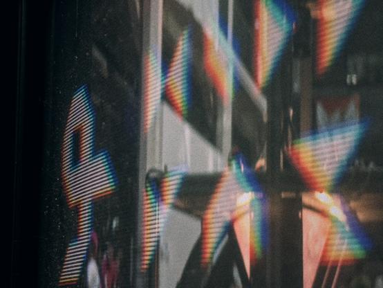 a close-up shot of the GPN23 logo displayed on one of the CRT monitors. parts of the venue are faintly visible in the reflection