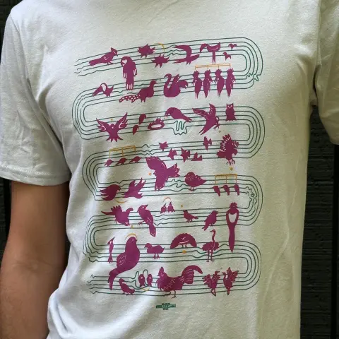 A beautiful t-shirt designed by Mirlo's friends at Transverse Co-operative, featuring a diverse flock of birds 🐦‍⬛ perched as notes on sheet music. Printed by unionized worker co-op Worx Printing.