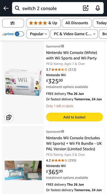Screenshot from an Amazon app. The search bar says “switch 2 console” and the results pane below lists two versions of the Nintendo Wii. This is what passes for humour here, folks!
