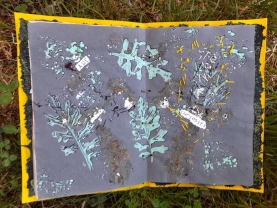 #10 Again a double page with these fern-like leaves, printed in mint green, with some black drawing and intuitive stitching in black and yellow. The printed words 'AWE' and 'curiosity'.