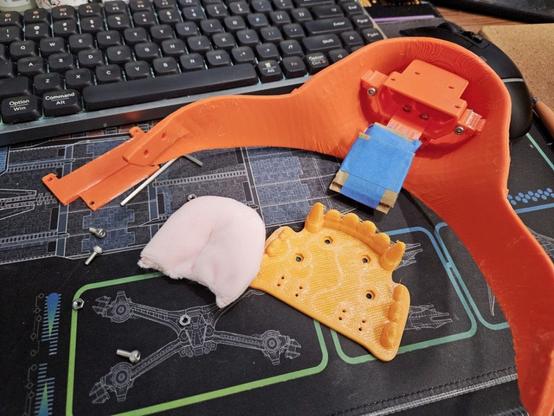Attaching the tongue to the jaw using the small holes.