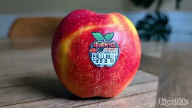 A hunnyz apple with the sticker on.