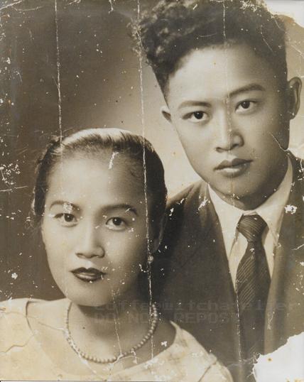 An old yellowed photo of my grandparents before restoration