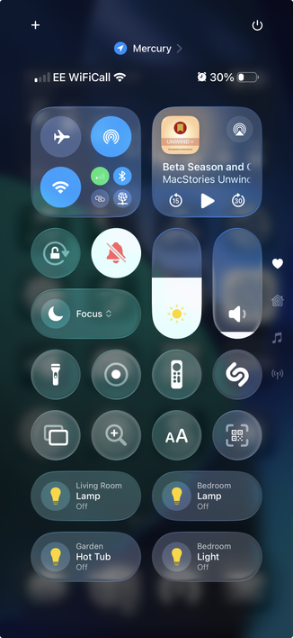 iPhone Control Center screenshot showing various controls: Wi-Fi and Bluetooth are on, airplane mode and personal hotspot are off. Battery is at 30% with Low Power Mode enabled. Focus mode is active. A podcast is playing. Smart home controls show lights and hot tub in the living room, bedroom, and garden are all off.