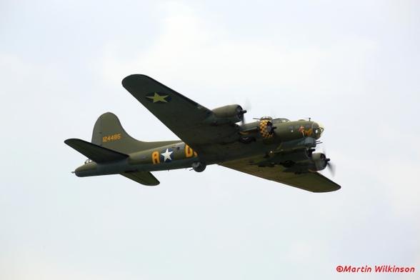 Boeing B17g Flying Fortress flies past at a Duxford air display.