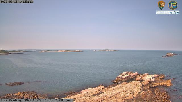 Camera looking north from Boston Light on Little Brewster Island. View looks toward the northern approaches into Boston Harbor, with Graves Light visible into the distance. The smaller Brewster Islands, Middle and Outer, are in the midground, with the Shag Rocks on the near right.