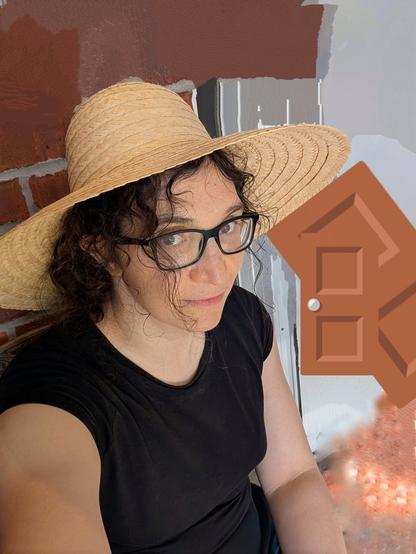 me wearing a BIG STRAW HAT in a non descript location