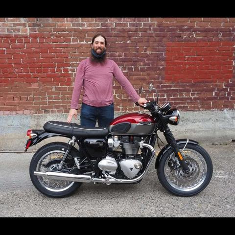 Photo by Neil E. Hodges on September 10, 2021. May be an image of 1 person, motorcycle, outdoors and brick wall.