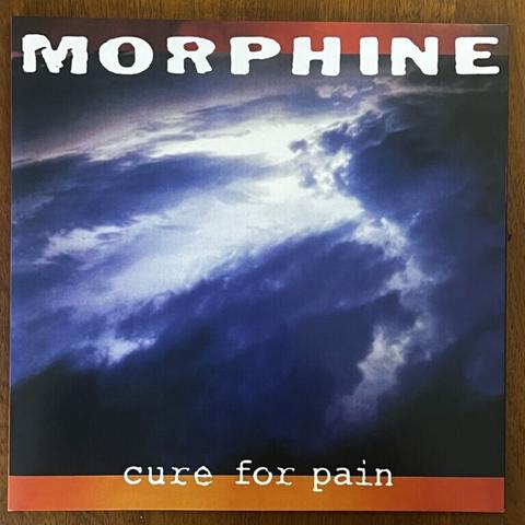Morphine Cure For Pain front cover – the band name is at the top, the title below (in a typewriter font). In between is a photograph of a stormy blue sky with strong clouds.
