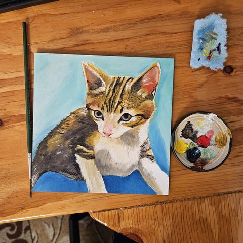 An unfinished 6x6 oil painting of a small brown tabby kitten giving her "sorry i bit you so hard" eyes