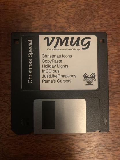 Photo of a floppy disk whose label reads:

VMUG (Victoria Macintosh User’s Group)
Christmas Special
 - Christmas Icons
 - CopyPaste
 - Holiday Lights
 - InCDious
 - JustLikeRhapsody
 - Pema’s Cursors