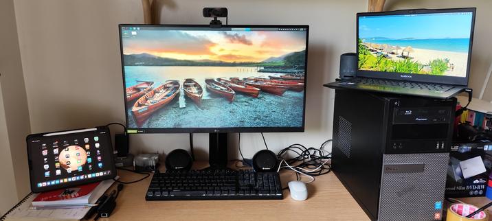 Image of my setup

From left to right:
- iPad Air 
- My main screen, keyboard and mouse
- My laptop on top of my Optiplex