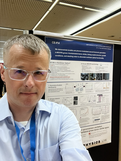 My face with my research poster in the background