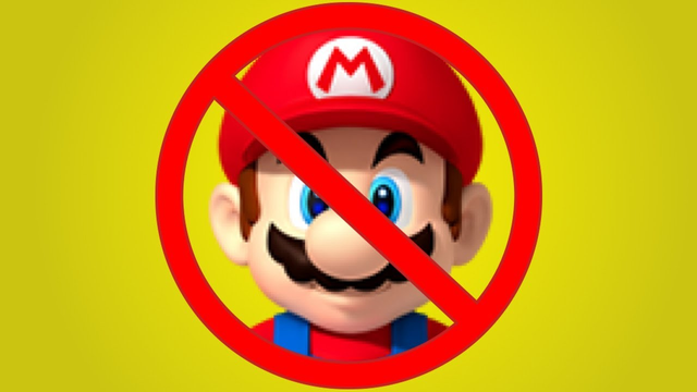 The image shows Mario, the Nintendo character, with a red circle and diagonal line through him, commonly known as a "no" symbol or "prohibited" sign. This indicates that Mario is being disallowed, prohibited, or blocked. The background is solid yellow.