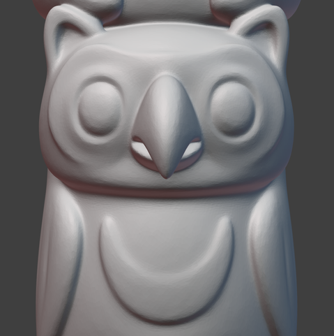 Blender 3D viewport screenshot, showing a stylized owl head in progress.