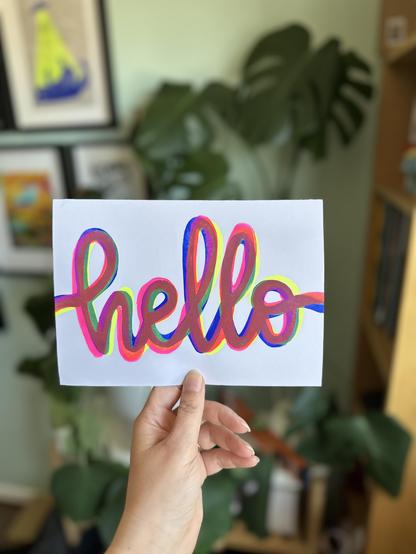 Impression d’une calligraphie « hello » en 3 couleurs superposées sur du papier format A5