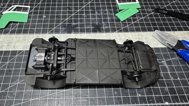 Painted chassis of a Volkswagen T1 Samba Bus Flower Power by Revell in 1:24