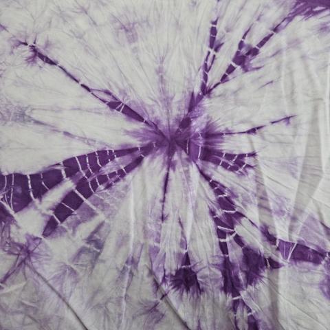 a pillowcase: mostly pale purple with spidery mottling that barely shows the concentric pale rings that are highlighted by the few deep purple streaks radiating from the center of the ring