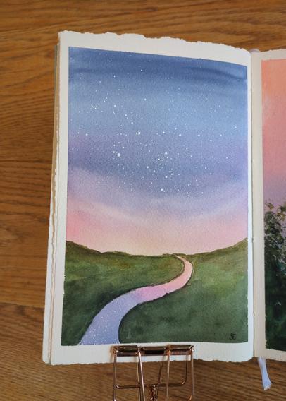 This is a watercolor landscape painting in portrait orientation of the sky at dusk overlooking a stream in a field. The sky is dusky blue to purple and pink to peach. There are stars in the dark blue and purple sky. The shy is reflected in the stream the curves from right to left through the meadow.